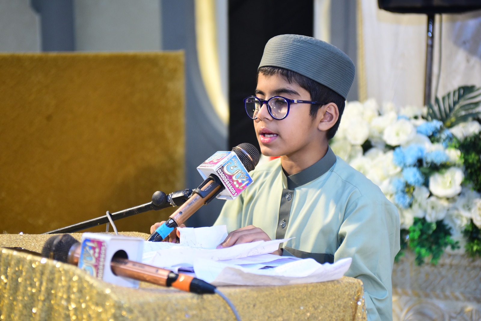 Yarmouk Schools student reciting at the annual ceremony